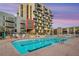 Exterior pool area offers a resort-like experience with pristine blue waters and comfortable lounge seating at 353 E Bonneville Ave # 447, Las Vegas, NV 89101
