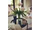Coffee table with flowers, a Perricone product and a mug of coffee at 353 E Bonneville Ave # 447, Las Vegas, NV 89101