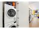 Convenient laundry area with stacked Bosch washer and dryer inside a cabinet at 3722 Las Vegas Blvd # 1709, Las Vegas, NV 89158