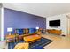 Spacious living room with stylish furniture, a modern television, and a vibrant accent wall at 3722 Las Vegas Blvd # 1709, Las Vegas, NV 89158