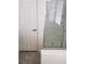 Modern bathroom featuring a walk-in shower with glass door and tiled flooring at 373 Wilford Springs St, Henderson, NV 89014