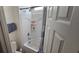Clean, white bathroom with a shower-tub combo and built-in shelving at 373 Wilford Springs St, Henderson, NV 89014