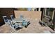 Outdoor patio with table, chairs, and bench, perfect for entertaining guests at 373 Wilford Springs St, Henderson, NV 89014