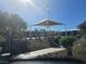 Community playground with green canopies, play equipment and common area at 373 Wilford Springs St, Henderson, NV 89014