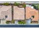 Aerial shot of three homes showing tile roofs and desert landscaping at 404 Via Sonador, Henderson, NV 89012