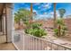Landscaped backyard featuring mature palm trees and rock features at 404 Via Sonador, Henderson, NV 89012