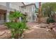 Backyard shows lush landscaping, decorative water feature, and spiral staircase at 404 Via Sonador, Henderson, NV 89012