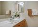 Bathroom features a white countertop vanity with double mirrors and updated fixtures at 404 Via Sonador, Henderson, NV 89012