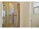 Bright bathroom featuring a glass enclosed shower and white tiled wall with grab bar at 404 Via Sonador, Henderson, NV 89012
