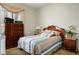 Cozy bedroom with warm neutral tones, decorative lamps, and bedside table at 404 Via Sonador, Henderson, NV 89012