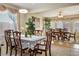 Formal dining area featuring elegant wood furniture and bright natural light at 404 Via Sonador, Henderson, NV 89012
