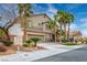 Two-story home with desert landscaping, a two-car garage, and a paved driveway at 404 Via Sonador, Henderson, NV 89012