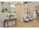 Well-lit foyer features a decorated mirror and staircase to the second floor at 404 Via Sonador, Henderson, NV 89012