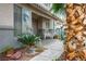 Inviting front porch with decorative seating and manicured landscaping, enhancing the home's exterior at 404 Via Sonador, Henderson, NV 89012