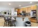 Spacious kitchen features a large island with seating and stainless steel appliances at 404 Via Sonador, Henderson, NV 89012