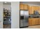 Kitchen with stainless steel refrigerator and walk-in pantry for ample storage at 404 Via Sonador, Henderson, NV 89012