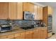 Kitchen features stainless appliances, tile backsplash and gas range at 404 Via Sonador, Henderson, NV 89012