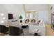 Bright living room with modern furniture, large windows, and a neutral color palette, creating a welcoming atmosphere at 404 Via Sonador, Henderson, NV 89012