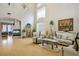 Elegant living room featuring a fireplace, high ceilings, and sophisticated decor, exuding luxury and comfort at 404 Via Sonador, Henderson, NV 89012