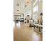 Expansive living room with a fireplace, high ceilings, and elegant decor, ideal for gatherings and relaxation at 404 Via Sonador, Henderson, NV 89012