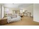 Spacious bedroom featuring plush carpet, plantation shutters and a ceiling fan at 404 Via Sonador, Henderson, NV 89012