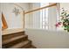 Carpeted staircase with decorative wood and white railing at 404 Via Sonador, Henderson, NV 89012