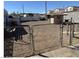 View of the backyard area enclosed by chain link fence at 424 Jefferson Blvd, Henderson, NV 89011