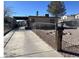 View of the home showing the long driveway at 424 Jefferson Blvd, Henderson, NV 89011