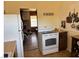 Kitchen featuring white oven range and doorway to living area at 424 Jefferson Blvd, Henderson, NV 89011