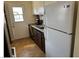Functional kitchen with a refrigerator, sink and white door for natural light at 424 Jefferson Blvd, Henderson, NV 89011