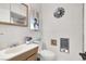 A clean bathroom with a neutral color scheme, vanity, and a unique fan decoration at 5005 Harmony Ave, Las Vegas, NV 89107