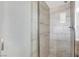 A modern tiled shower room with a frosted glass door and a built-in niche at 5005 Harmony Ave, Las Vegas, NV 89107