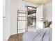 Simple, unfurnished bedroom with white walls, minimal decor, and an access door to the backyard at 5005 Harmony Ave, Las Vegas, NV 89107