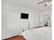A bedroom with ample closet space and minimalist decor for relaxing at 5005 Harmony Ave, Las Vegas, NV 89107