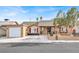 Charming single-story home featuring a well-manicured lawn and a freshly painted facade at 5005 Harmony Ave, Las Vegas, NV 89107