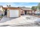 Cozy single-story home with attached garage and ample parking space at 5005 Harmony Ave, Las Vegas, NV 89107