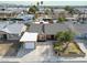 Aerial view of a charming single-story home with attached garage and well-maintained landscaping at 5005 Harmony Ave, Las Vegas, NV 89107