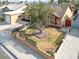Overhead shot of a home with mature shade tree, small green lawn, and enclosed landscaped area at 5005 Harmony Ave, Las Vegas, NV 89107