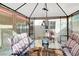Beautifully decorated gazebo with outdoor dining table, comfortable chairs, and modern lighting fixtures at 5005 Harmony Ave, Las Vegas, NV 89107