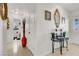 A hallway decorated with ornate mirrors and an ornate table that leads to the bathroom at 5005 Harmony Ave, Las Vegas, NV 89107