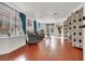 Bright living room featuring wood floors, window seating and decorative folding screen, providing a cozy retreat at 5005 Harmony Ave, Las Vegas, NV 89107