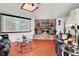Inviting living area with brick fireplace, movie screen, and comfortable seating, perfect for entertainment at 5005 Harmony Ave, Las Vegas, NV 89107