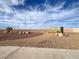 A view of the community park with walkways, decorative rocks, and desert landscaping at 5005 Harmony Ave, Las Vegas, NV 89107