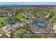 Extensive aerial view of tennis and pickle ball courts with lush green landscaping at 5104 Elm Grove Dr, Las Vegas, NV 89130