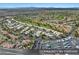 Panoramic aerial view of a community featuring RV parking, golf course and green landscaping at 5104 Elm Grove Dr, Las Vegas, NV 89130