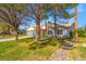 Charming single-story home with mature trees and a well-manicured lawn at 5104 Elm Grove Dr, Las Vegas, NV 89130