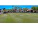 Beautiful golf course view with lush green grass and a fleet of golf carts ready for a round at 5104 Elm Grove Dr, Las Vegas, NV 89130