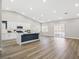 A large living room featuring recessed lighting, vaulted ceilings, and light hardwood floors at 5104 Elm Grove Dr, Las Vegas, NV 89130