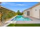 Sparkling pool with surrounding patio and lush landscaping for outdoor relaxation and enjoyment at 5104 Elm Grove Dr, Las Vegas, NV 89130