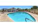 Relaxing community swimming pool with clear blue water and a comfortable lounging area at 5104 Elm Grove Dr, Las Vegas, NV 89130